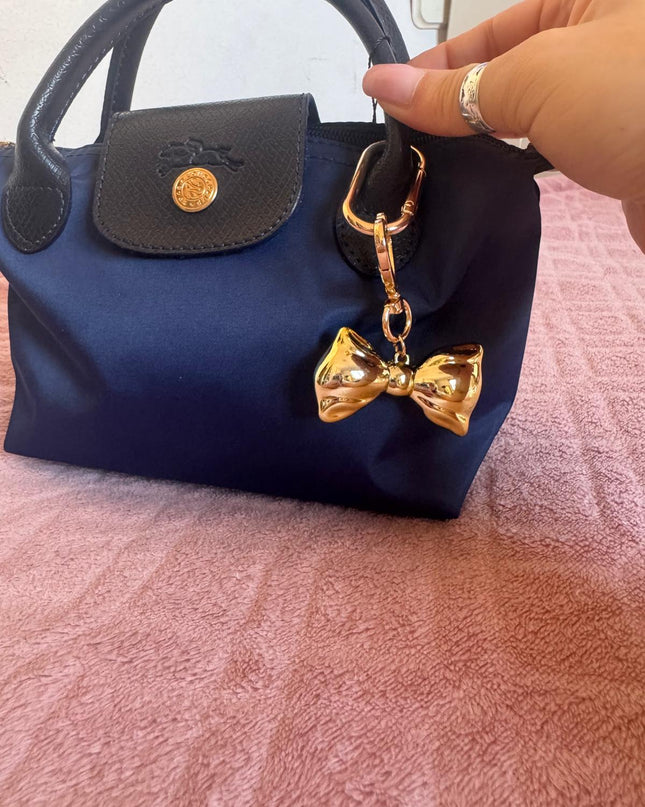 Dodatak za torbice - zlatna mašna