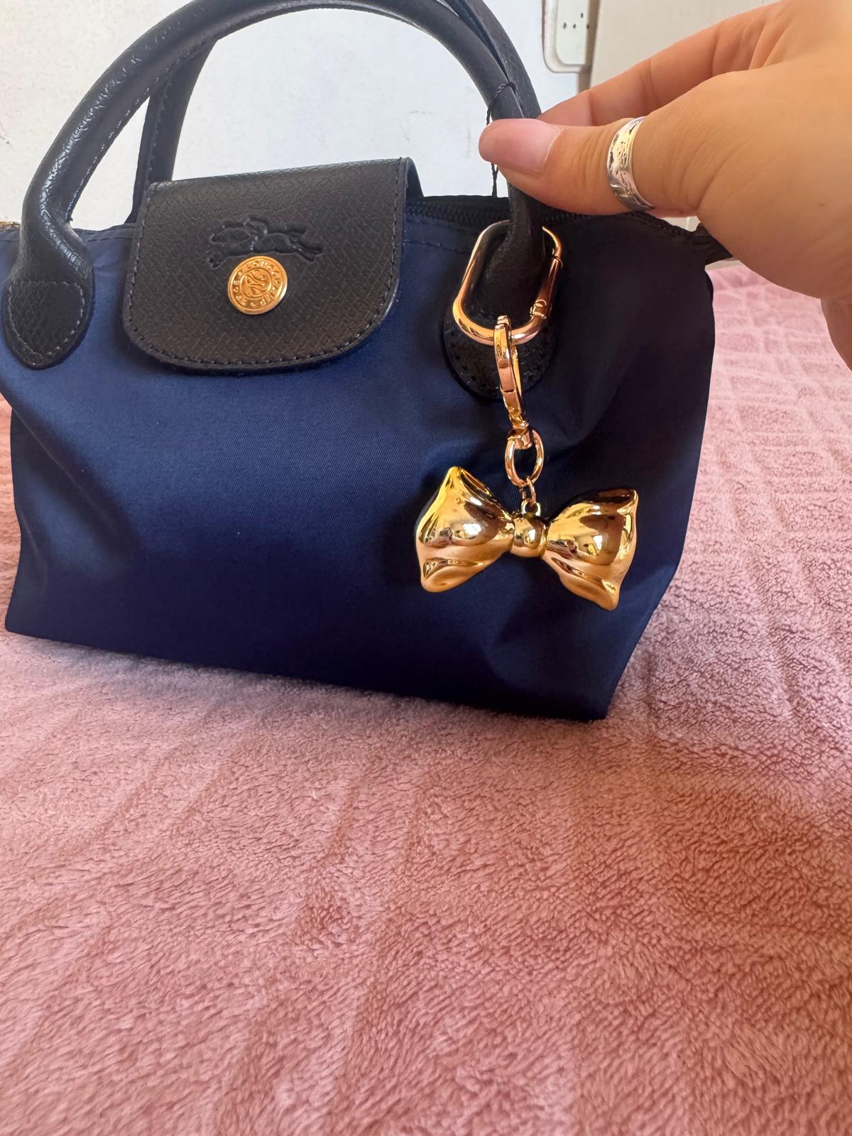 Dodatak za torbice - zlatna mašna